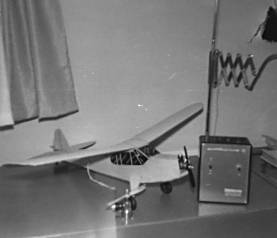 [Piper Cub model airplane, with transmitter]